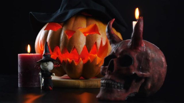 Halloween. Pumpkin, skull, candle, witch. Static camera