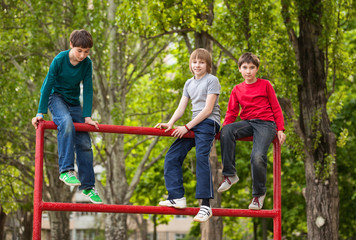 Naklejka na ściany i meble Happy boys on top of ladder