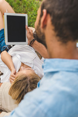 young couple with tablet