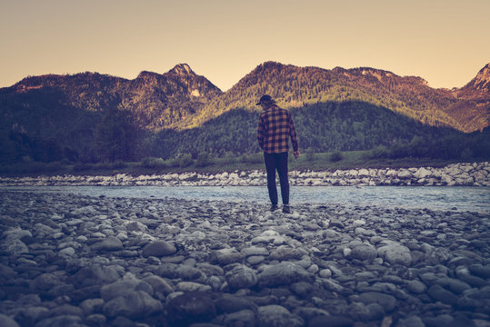 Germany, Bavaria, Traunstein, man standing at riverbank