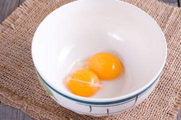 Raw yolks in a ceramic bowl