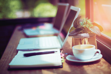 Pen and notebook with laptop.Inspiration moment,workspace or coffee break in the morning/ selective focus
