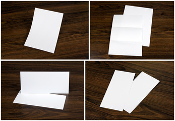 Set of Blank white flyers over wooden background