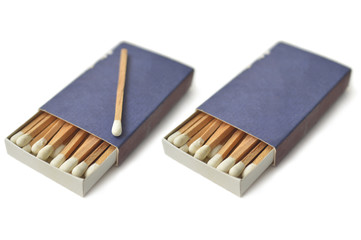 Wooden white matches in matchbox on white background