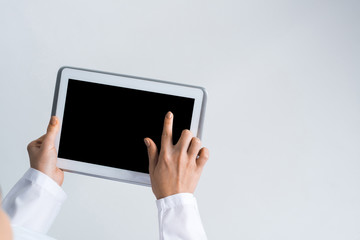 Close of female doctor hands working with tablet pc computer