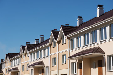 Obraz premium A row of just finished new yellow townhouses.