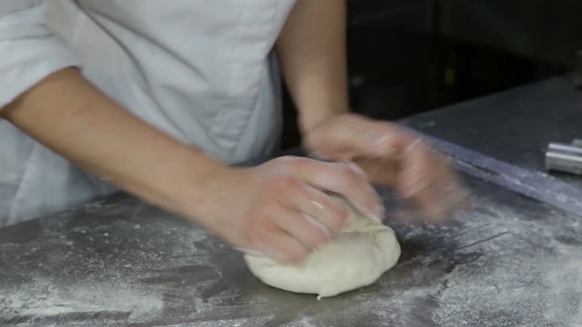 chef prepares bread to bake 