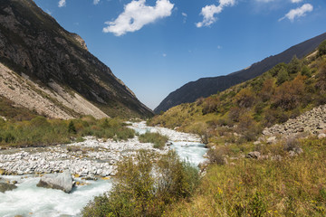 Fototapeta na wymiar River valley in the mountains of Kyrgyzstan