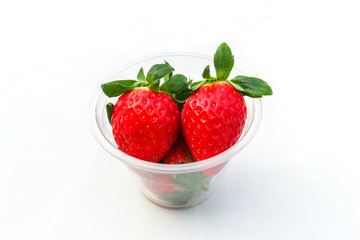 Strawberry in cup white background.