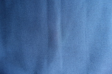 Surface of simple blue fabric from above