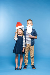 kids with santa hat and fake beard