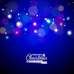 Obraz premium Glowing Colorful Christmas Lights for Xmas Holiday and Happy New Year Greeting Cards Design on Shiny Blue Background.
