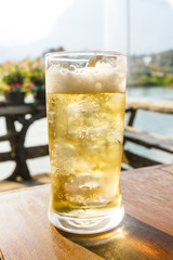 Glass of beer with ice.