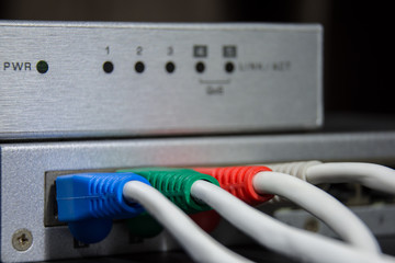 close-up of network hub and rj45 cables