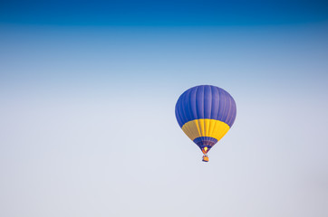 Colorful of hot air balloon with fire and blue sky background