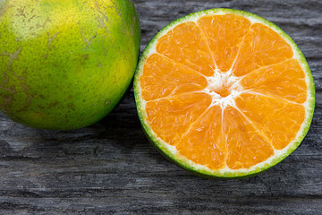 half of orange ,Oranges on the wooden table ,Close Up of Orange