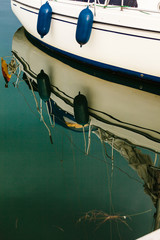 Sport yacht boat side reflecting in water