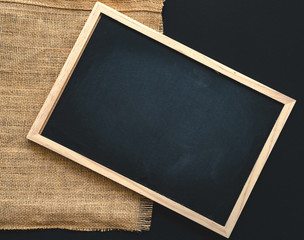 Abstract chalk blackboard with chalk scratch on sack fabric , ready used as background for add text or graphic