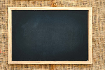 Abstract chalk blackboard with chalk scratch on sack fabric , ready used as background for add text or graphic