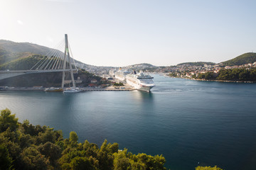 Naklejka premium Frank Tudman's Bridge. Suspension bridge over the water in Dubrovnik and ships in the port.