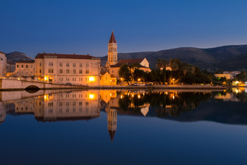 Obraz premium Waterfront view of beautiful Trogir, Croatia - Unesco World Heritage Site. Image take before sunrise, at the blue hour.