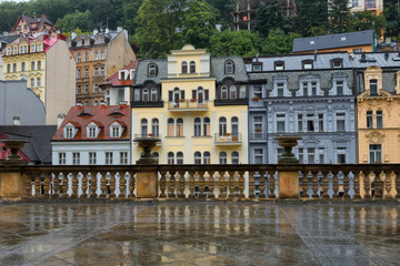 Several houses on the embankment of the Tepla River in Karlovy Vary, Czech Republic. View from the...