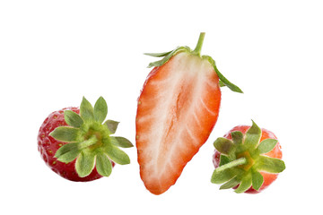 Isolated strawberries. Collection of whole and cut strawberry fruits isolated on white background with clipping path
