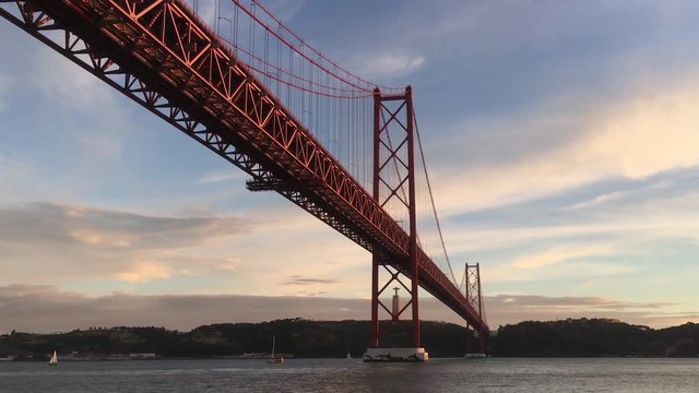 Zoom In Famous Bridge In Tagus River, Lisbon. Lisbon is the capital and the largest city of Portugal