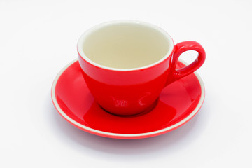 red ceramic cup on white background