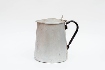 Aged tin kettle isolated