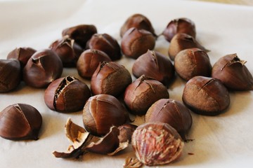Baked chestnuts on the table prepared for baking