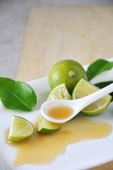Honey on Spoon with Fresh Lime