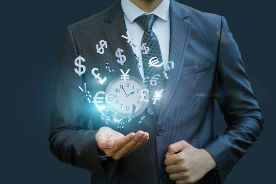 Wall clock and currency symbols shows the businessman .