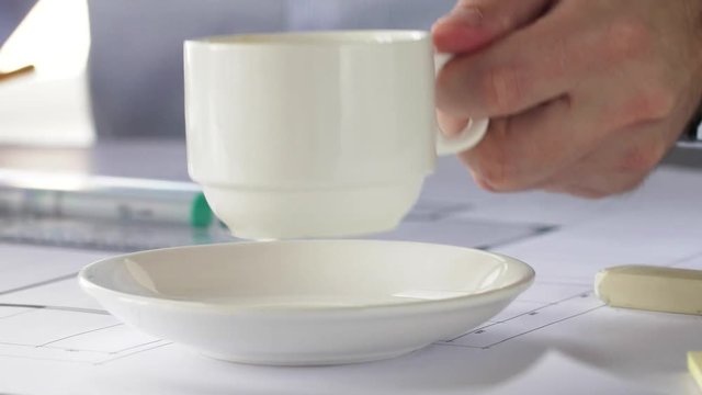 close up of architect drinking coffee