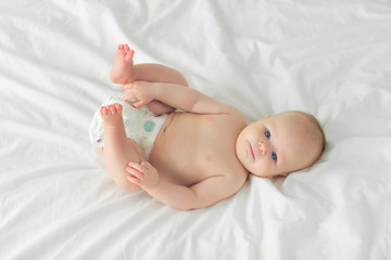 Portrait of a child four months on bed