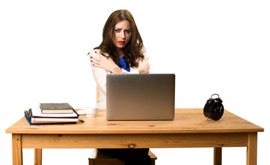 freezing business woman working with her laptop