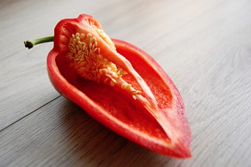 detail of red paprika on wooden table - 174738372