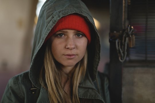 Portrait of young woman in hooded jacket