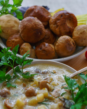 Homemade soup with mushrooms and sour cream, on the table.