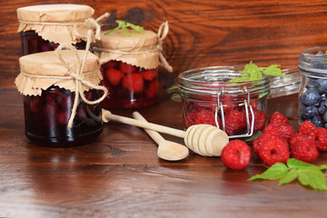 blueberries and raspberries in jars for the winter tea