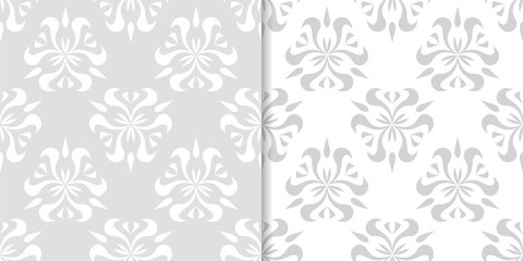 Light gray floral backgrounds. Set of seamless patterns