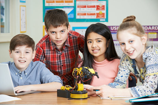 Portrait Of Pupils In Science Lesson Studying Robotics