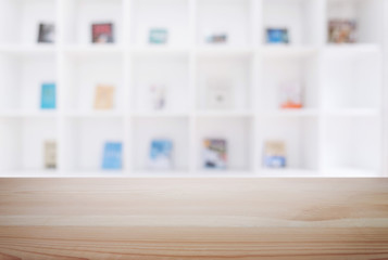 Empty wooden table and blur background of abstract in front of modern library or knowledge source can be used Mock up for display of product or for montage
