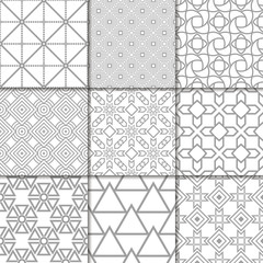 Light gray geometric ornaments. Collection of seamless patterns