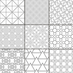 Fototapeta premium Light gray geometric ornaments. Collection of seamless patterns