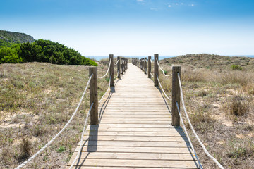 Fototapeta na wymiar Menorca, Steg zum Meer