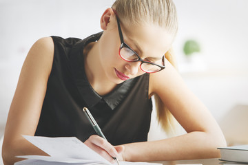 European woman doing paperwork