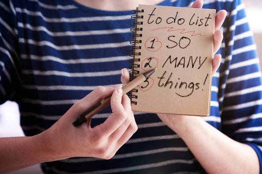 Woman writing to do list