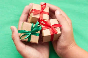 three little cute gift in hands