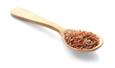 Wooden spoon with red Cargo rice on white background